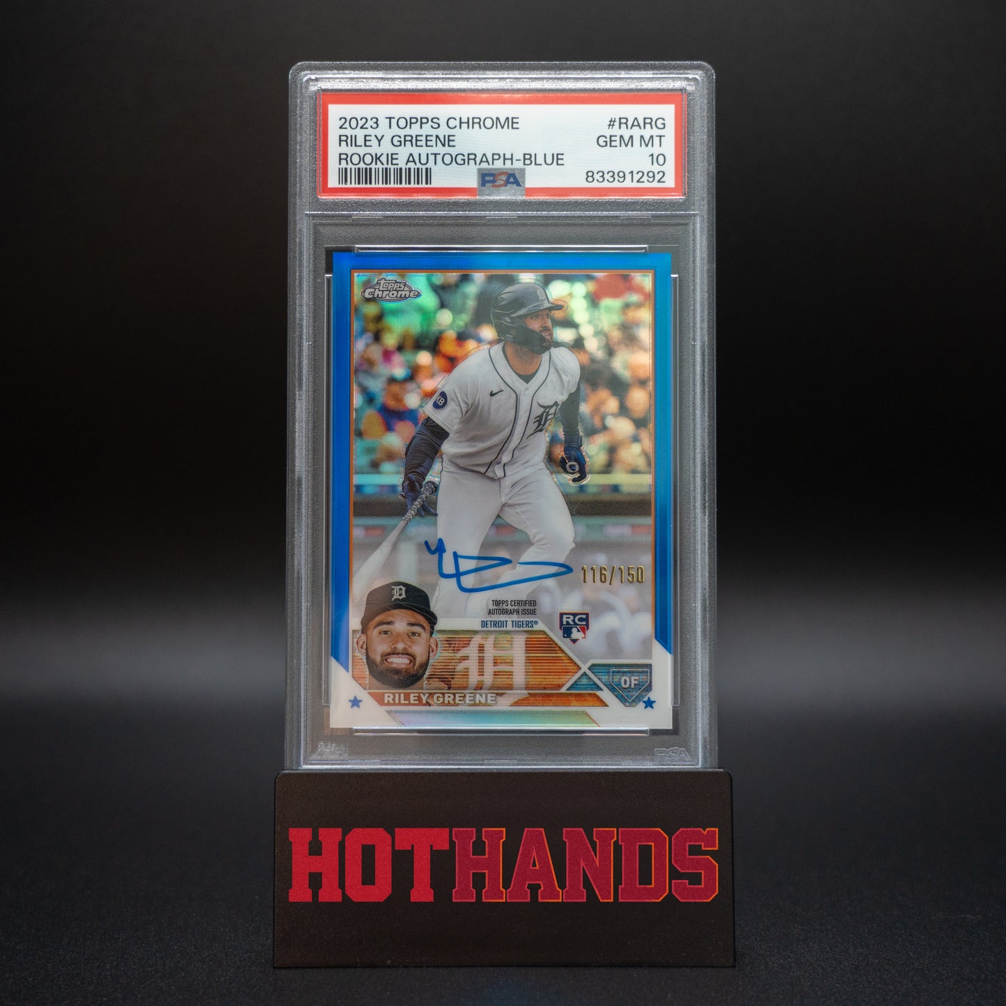 2023 Topps Chrome Riley Greene Blue Rookie Autograph card, graded PSA 10, numbered 116/150, displayed on a Hot Hands stand.