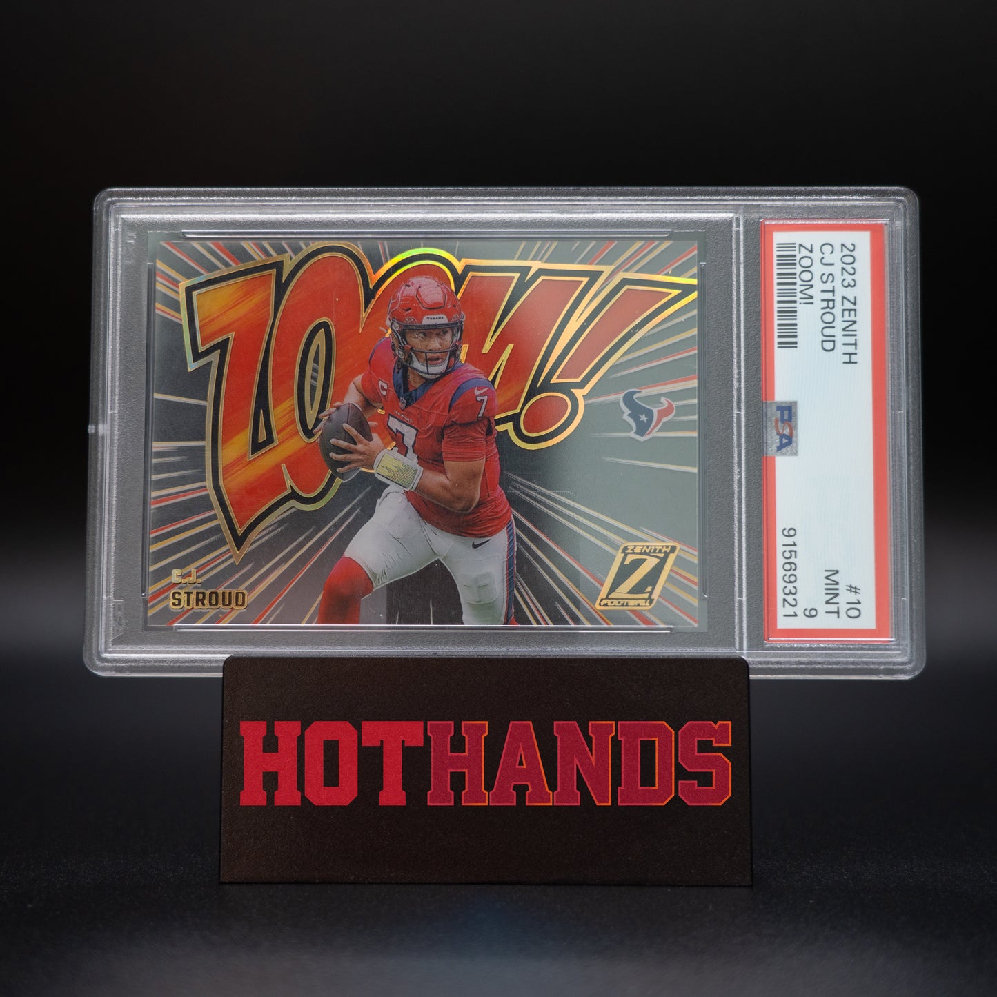 2023 Zenith CJ Stroud Zoom PSA 9 graded card displayed on a Hot Hands stand.